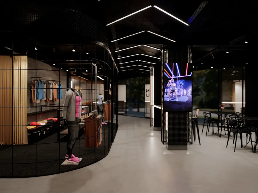 Loja de moda fitness com vitrine circular e mesas ao lado